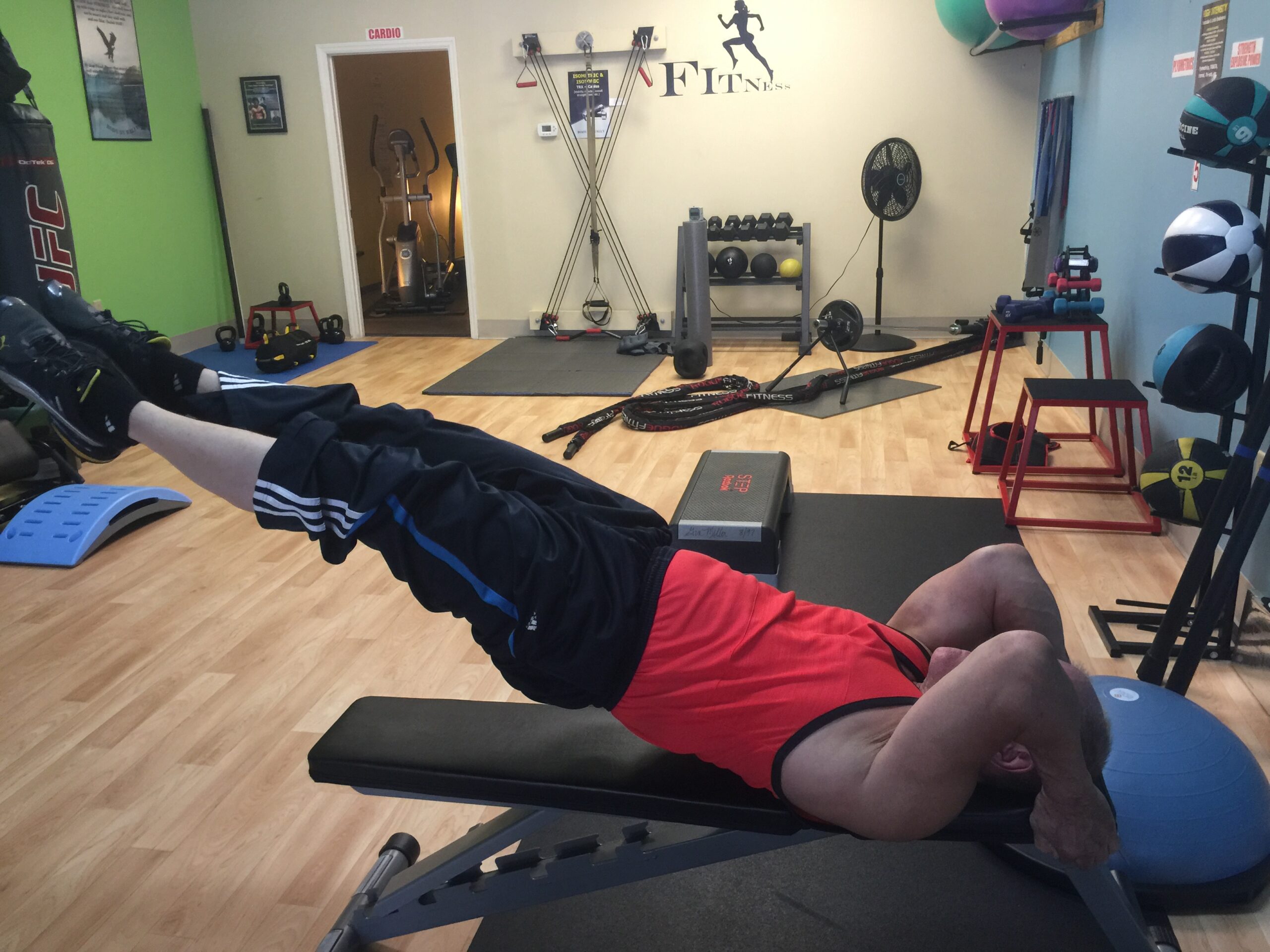 Wally, 65, performing an ab workout to maintain core strength and fitness at Body By Wally in Augusta.