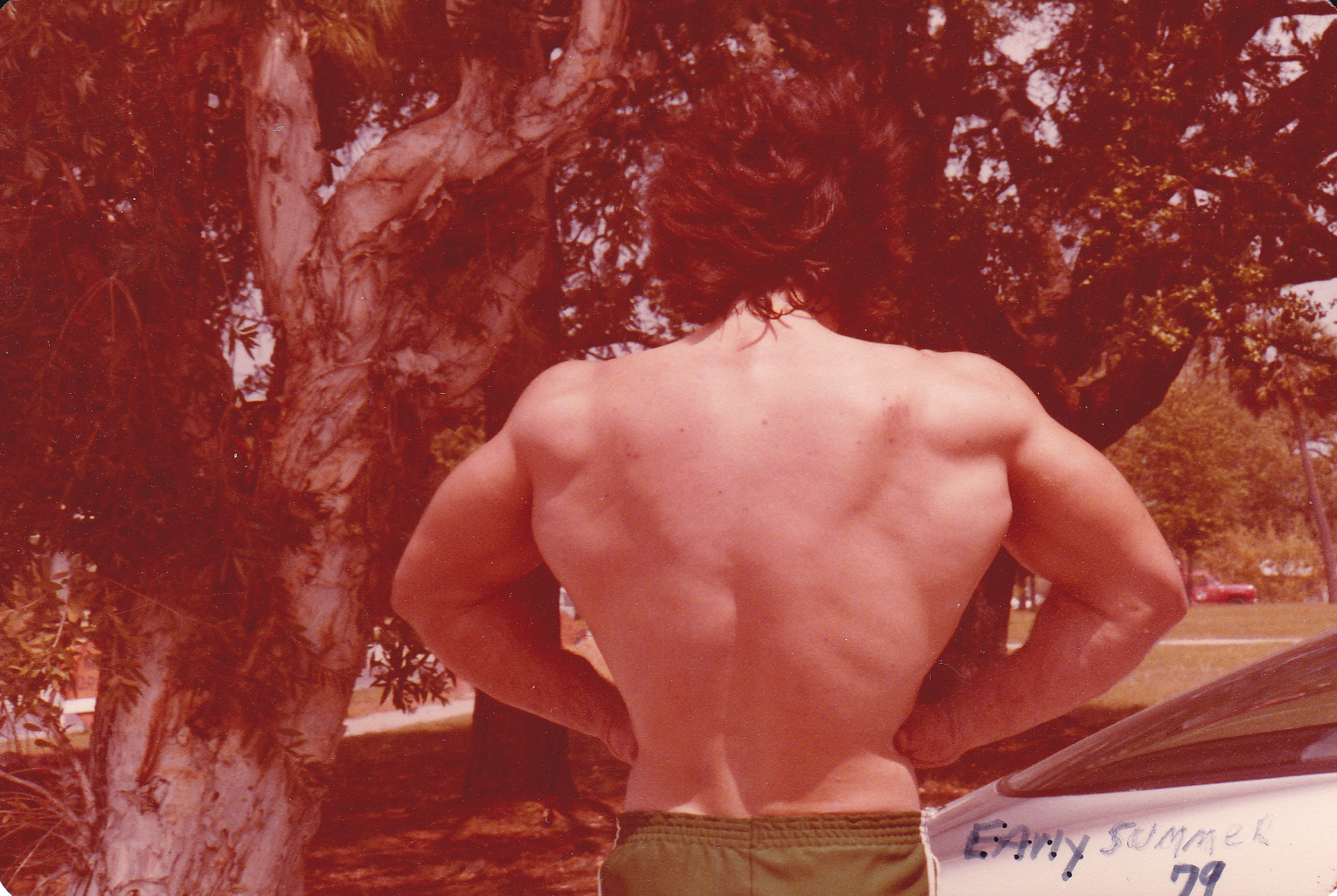 Wally, in his younger years, striking a bodybuilding pose to showcase his strength and physique.